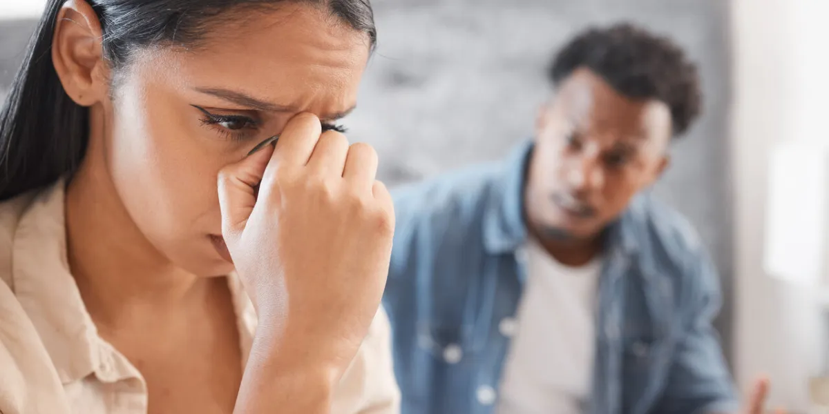 divorce, stress and couple fight on a bed, noise and conflict with toxic man and woman interracial relationship issue with young husband and wife in conflict, breakup and abuse bedroom problem