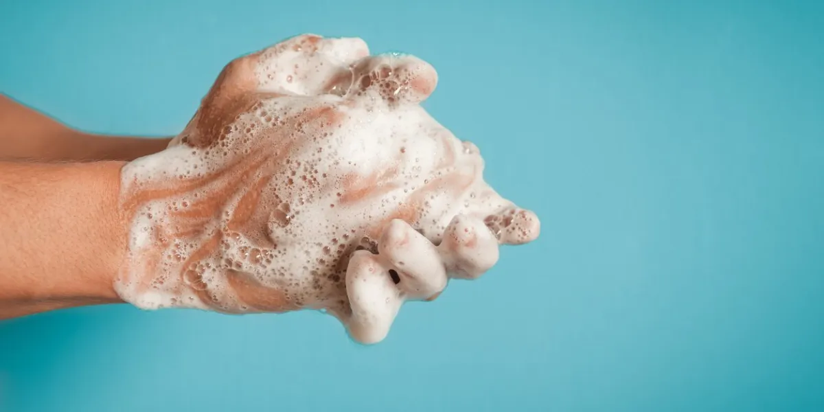 man washing hands, studio shot