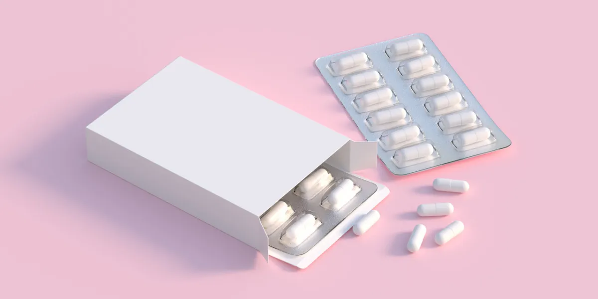 mockup template with two blisters with white pills capsules in p