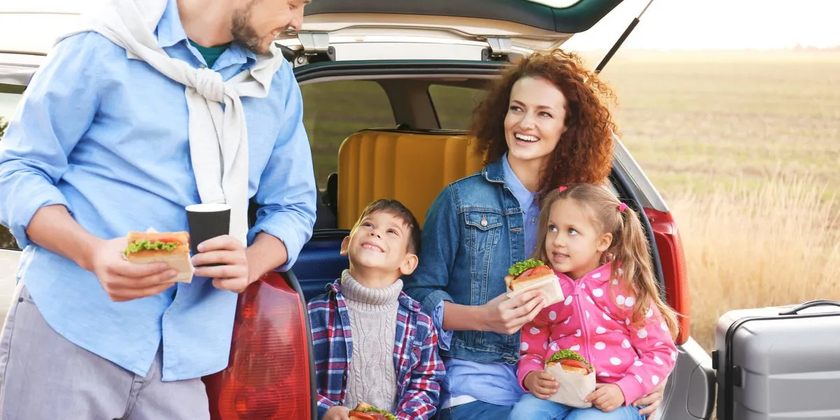 young family with children near car, outdoors