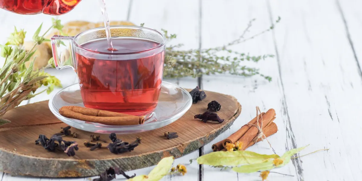 winter herbs and spices tea in glass teapot or mug, alternative medicine for the immune system, herbal hot drink concept