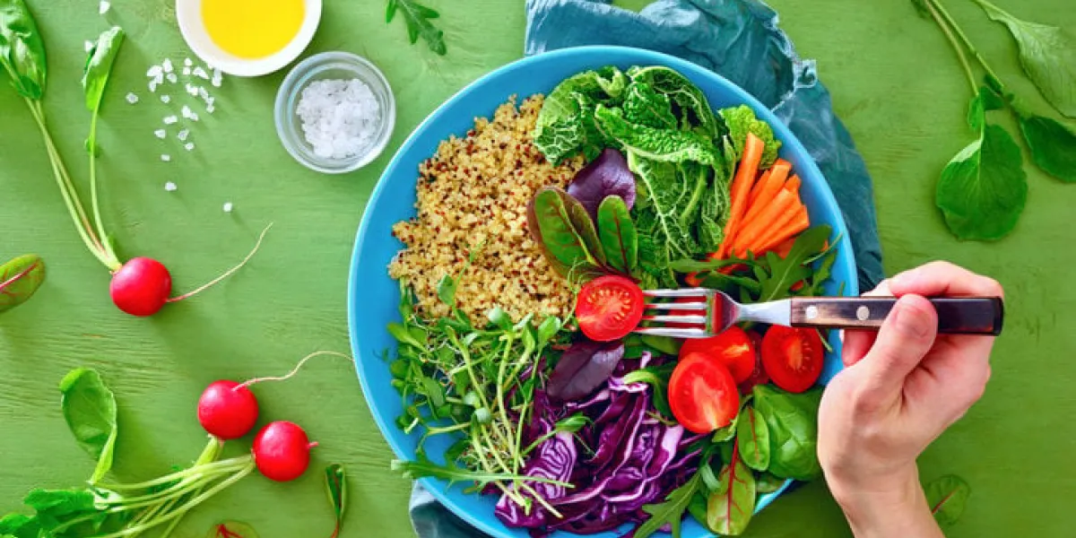 buddha bowl healthy vegan meal with kale, quinoa, various green sprouts and season greens, clean eating concept, view from above, flat lay