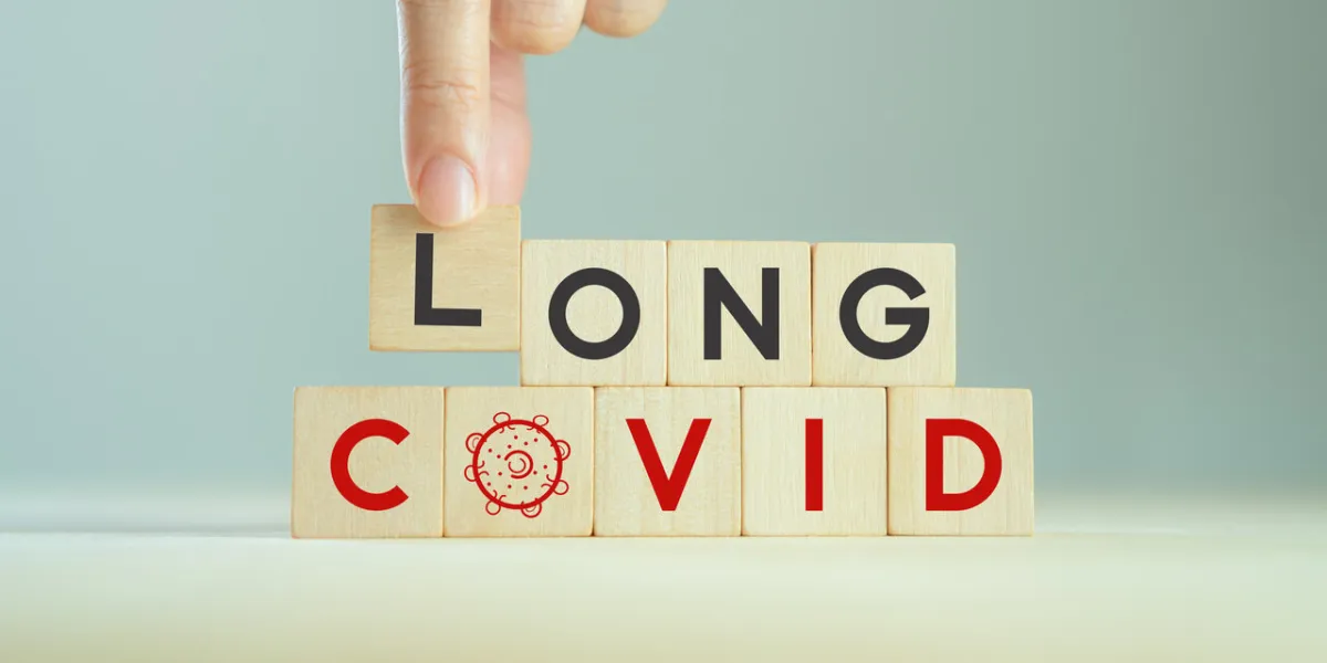 long covid, post covid concept long-term effects of coronavirus chronic fatigue or weakness, feeling tired easily medical, treatment for long covid symstoms, tips for recoverywooden cube blocks