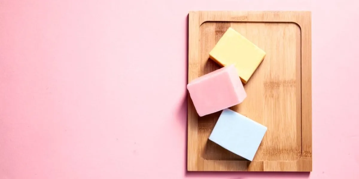 natural hand made soaps lying on the wooden desk