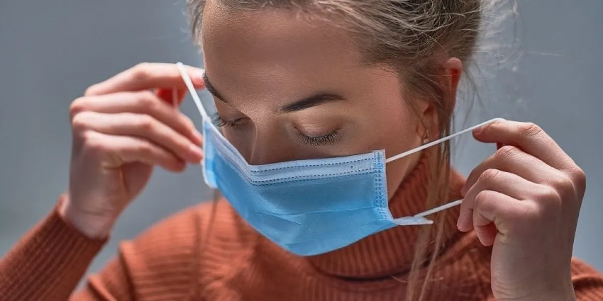 healthy woman putting on medical protective mask to health protection and prevention during flu virus outbreak, epidemic and infectious diseases