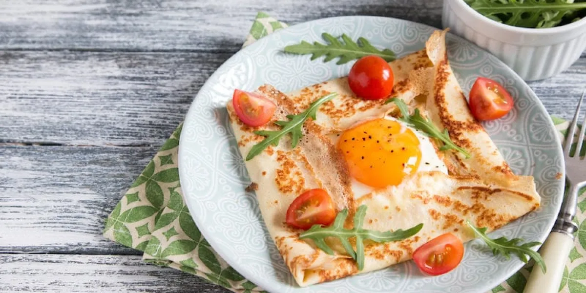 crepes with eggs, cheese, arugula leaves and tomatoes galette complete traditional dish galette sarrasin