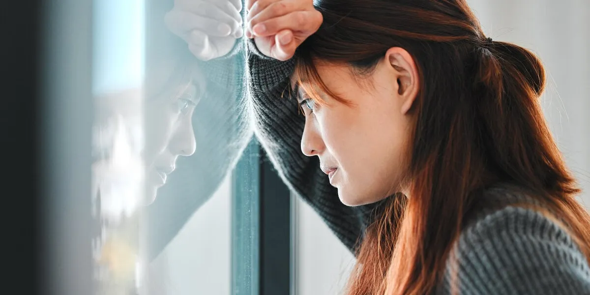 shot of a young female having a mental breakdown at home