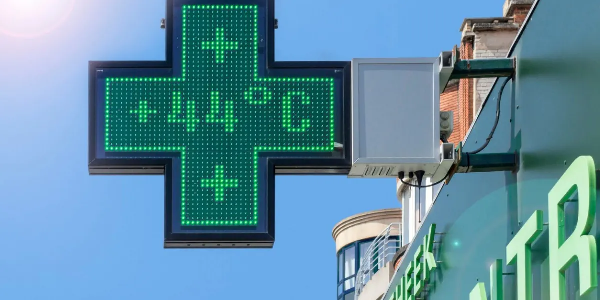 thermometer in green pharmacy screen sign displays extremely hot temperature of 44 degrees celsius during heatwave   heat wave in summer in belgium