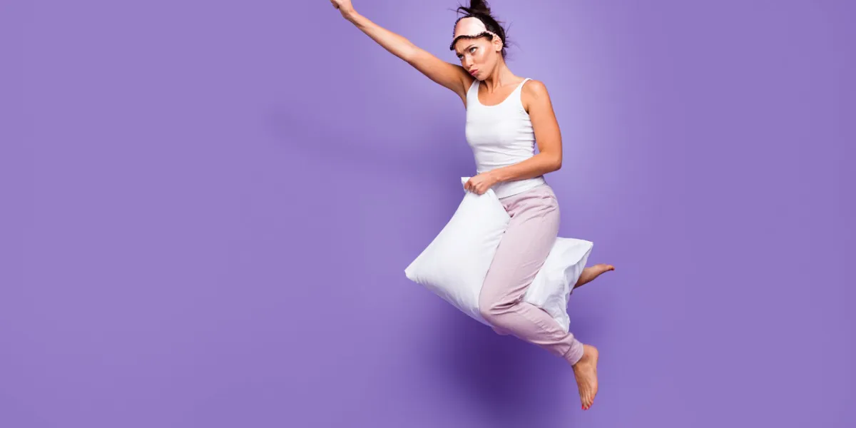full length side profile body size photo beautiful she her lady super power flight hold between legs pillow funny satisfied wear sleeping mask pants tank-top pajamas isolated violet purple background