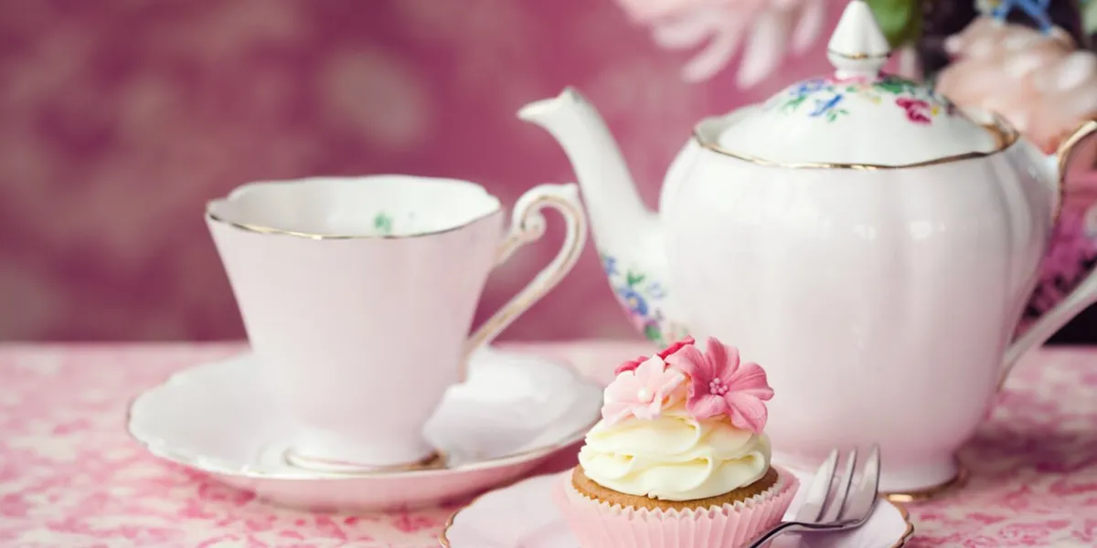 afternoon tea served with a flower cupcake on vintage china