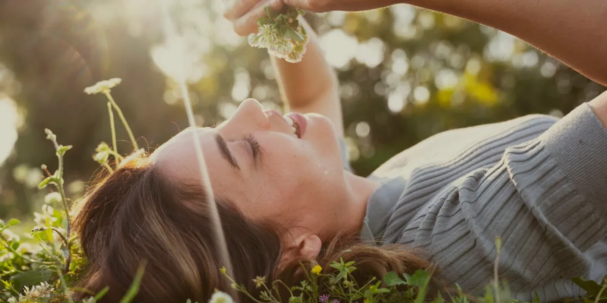 relaxed woman resting on the grass
