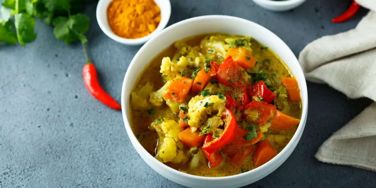 homemade vegetable curry in a white bowl