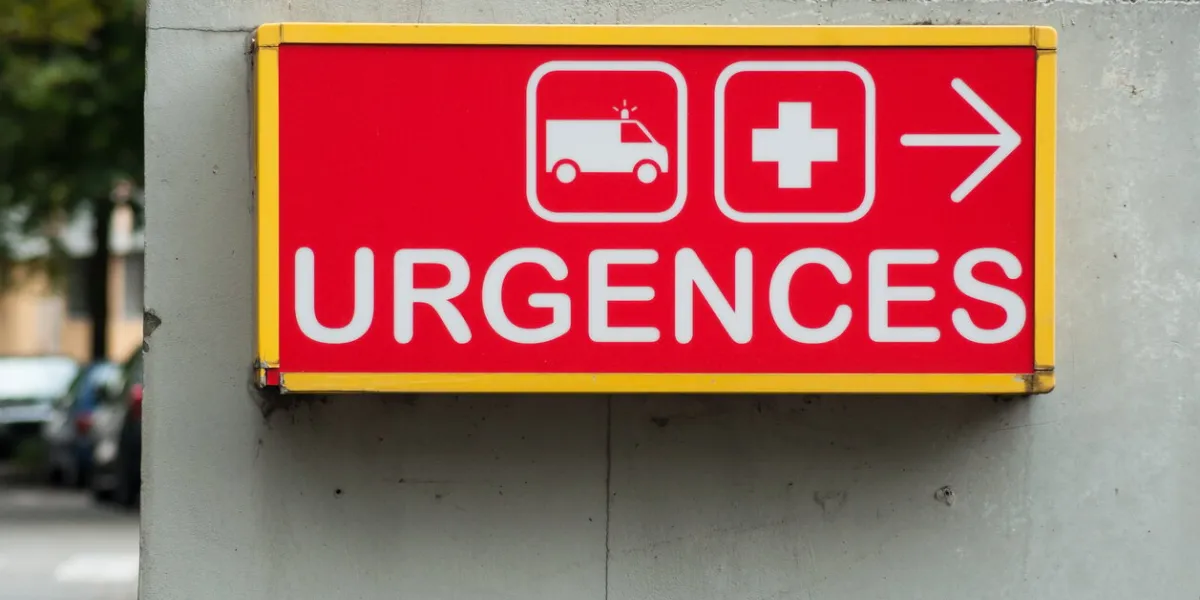 closeup of french hospital emergency entry sign with text in french ( urgences)