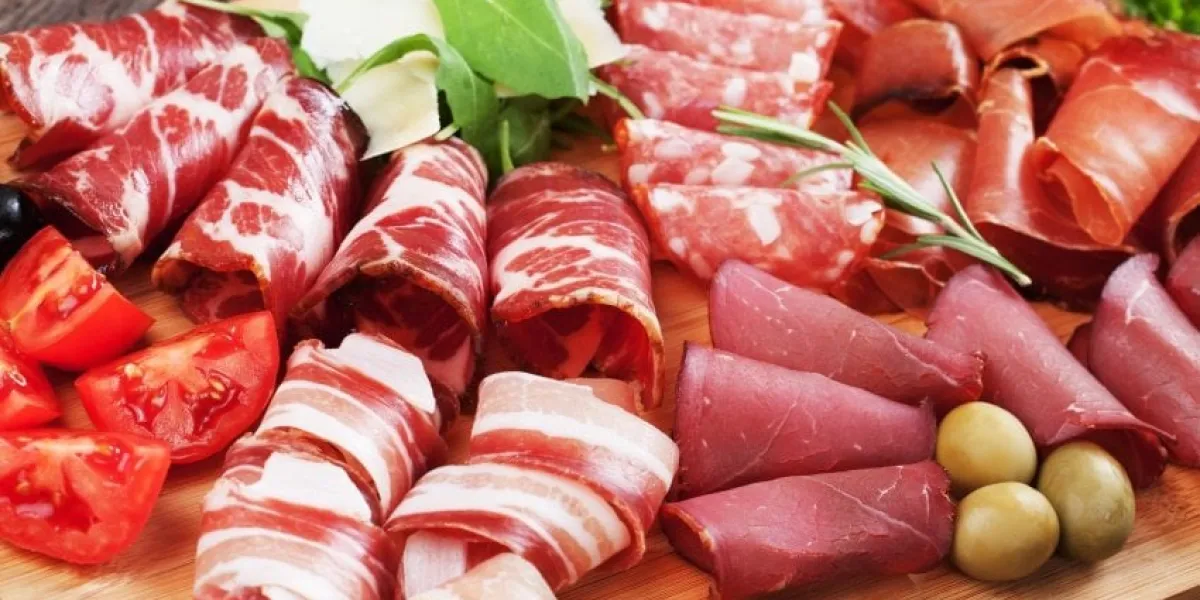 charcuterie board with italian style cured meat, pancetta, bresaola,capocollo,sausage and prosciutto