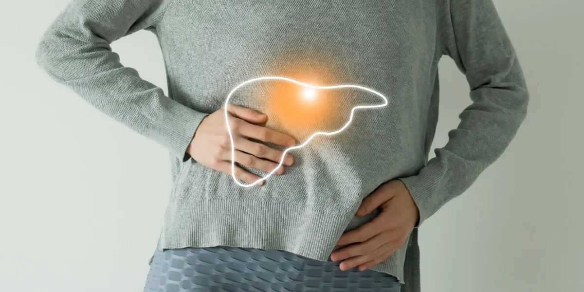 woman in casual grey clothes suffering from indigestion pain, highlighted vector visualisation of liver