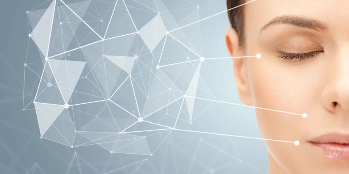 beauty, people and healthy skin concept - beautiful young woman face over gray background with low poly projection and pointers