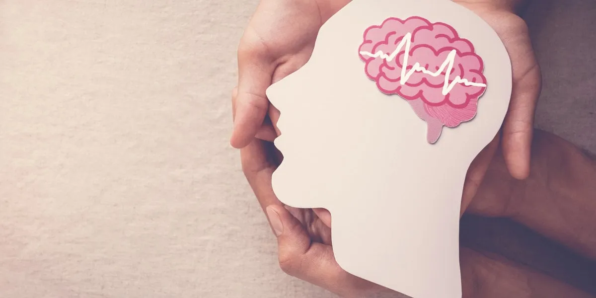 adult and child hands holding encephalography brain paper cutout, epilepsy and alzheimer awareness, seizure disorder, mental health concept