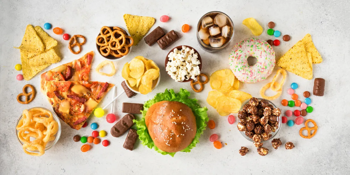 set of unhealthy food on white, top view, copy space unhealthy eating, junk food or tv snacks concept