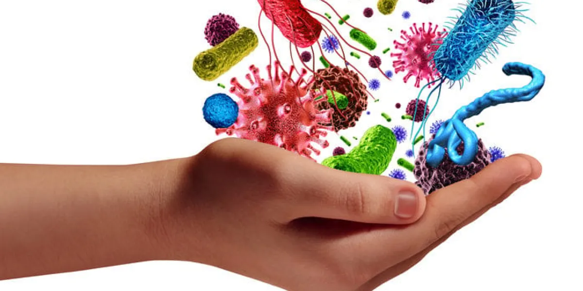 health and disease risk medical health care concept with a human hand holding microscopic cancer virus and bacteria cells as a metaphor for pathogen illness with 3d illustration elements