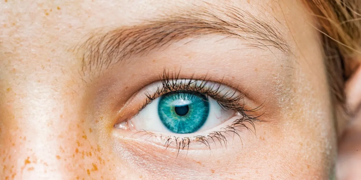 close-up of a female eye with blue iris