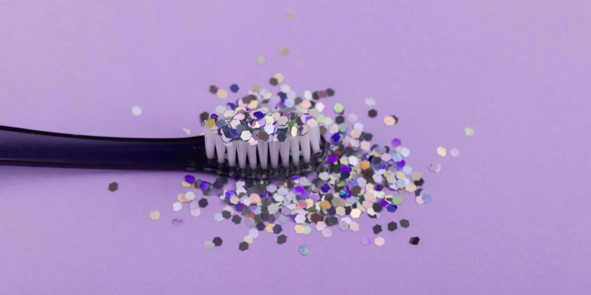 toothbrush with glitter, the concept of dentistry and hygiene