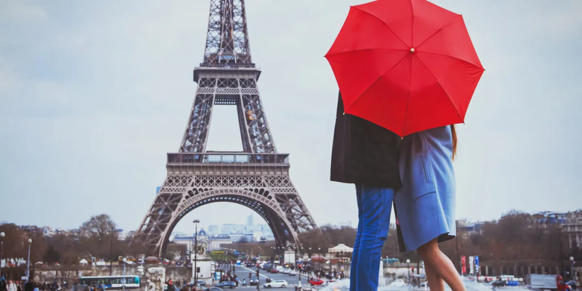 romantic holidays for couple in paris, honeymoon vacation in france, europe, man and woman kissing near eiffel tower