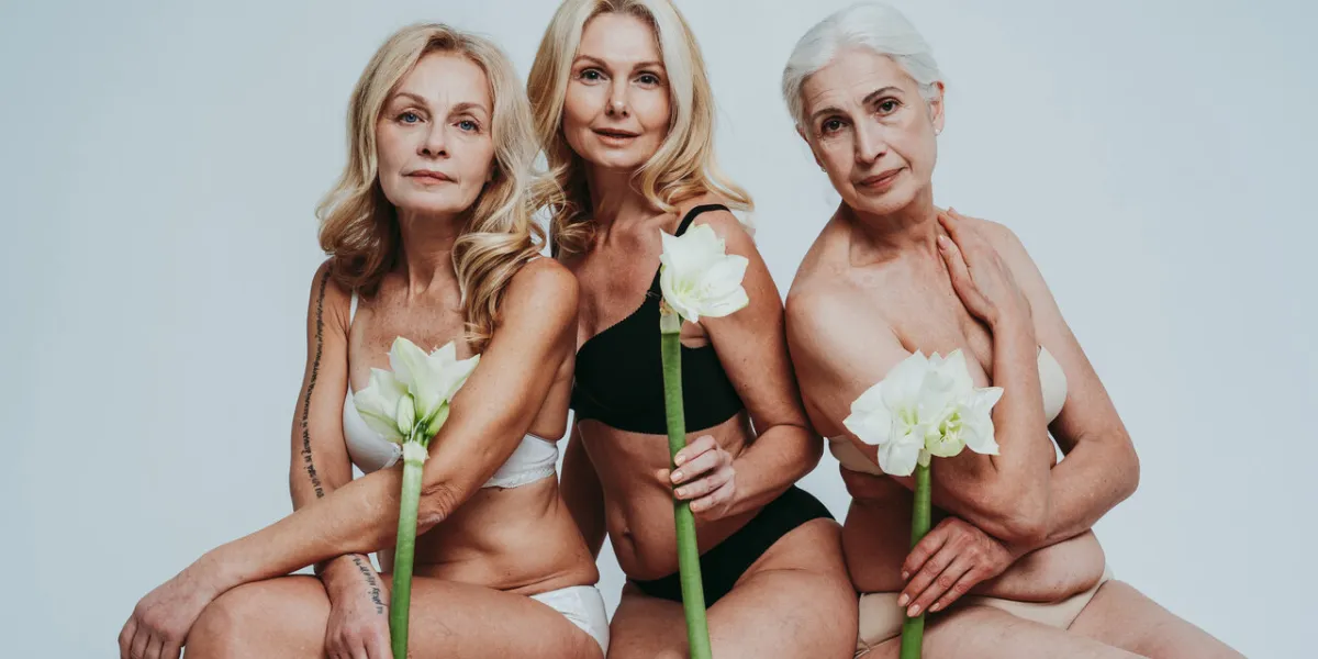 cincematic image of a beautiful senior women group posing on a beauty photo session middle aged women in lingerie on a grey background concept about body positivity, self esteem, and body acceptance