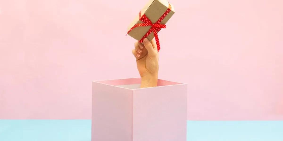 woman holding sex toy for adult gift box, special offer and sale time concept
