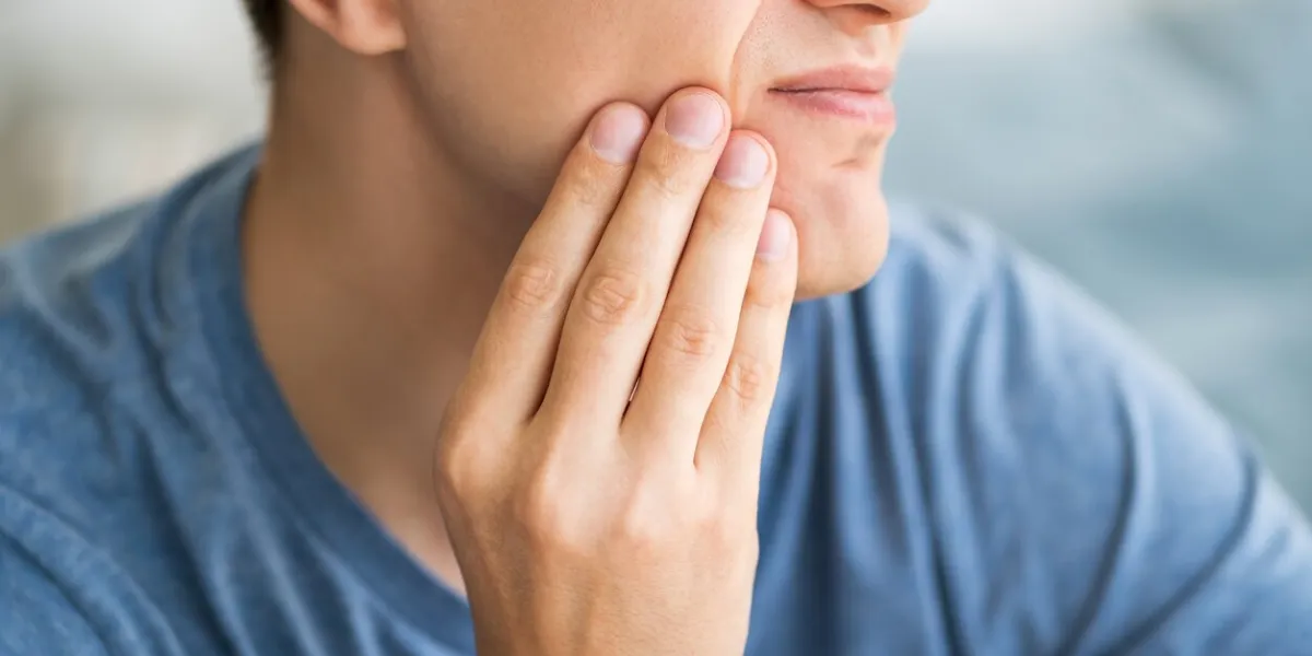 a man with toothache, periodontal disease in wisdom teeth, health problems concept