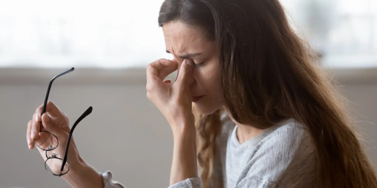 close up exhausted woman massaging eyelids, taking off glasses, tired freelancer or student suffering from eyestrain or dry eye syndrome, feeling dizziness or headache after long hours work